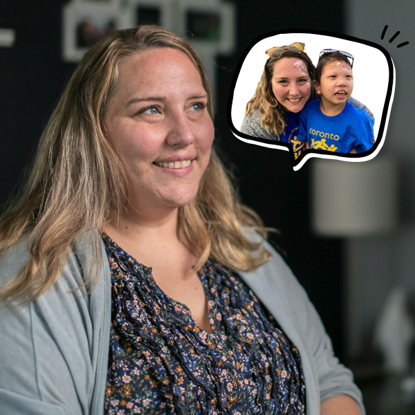 A woman with long blonde hair smiles, sitting indoors. A thought bubble shows her hugging her daughter.